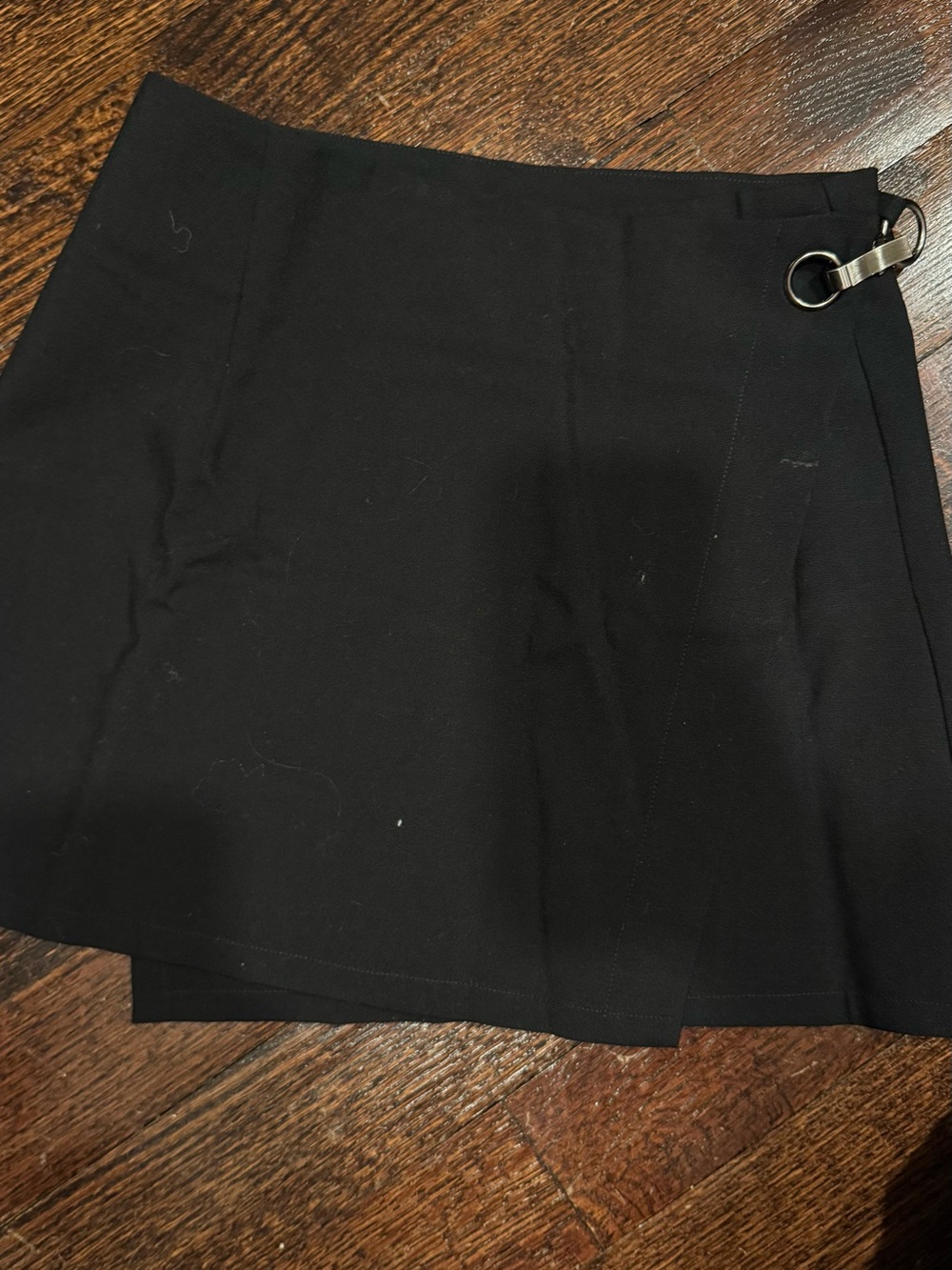 Black Assembly Mini Skirt with Ring Accent